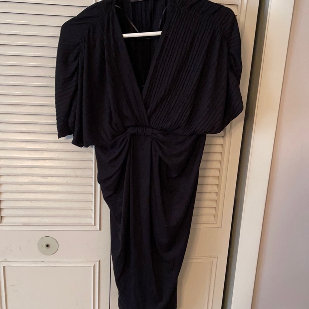 Black dress fits tight at bottom